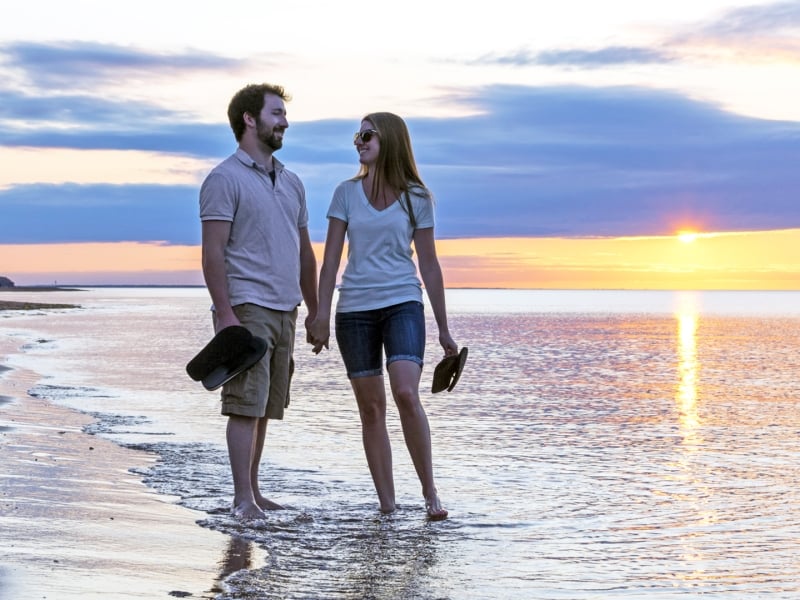 Darnley Beach, couple walking in water, sunset